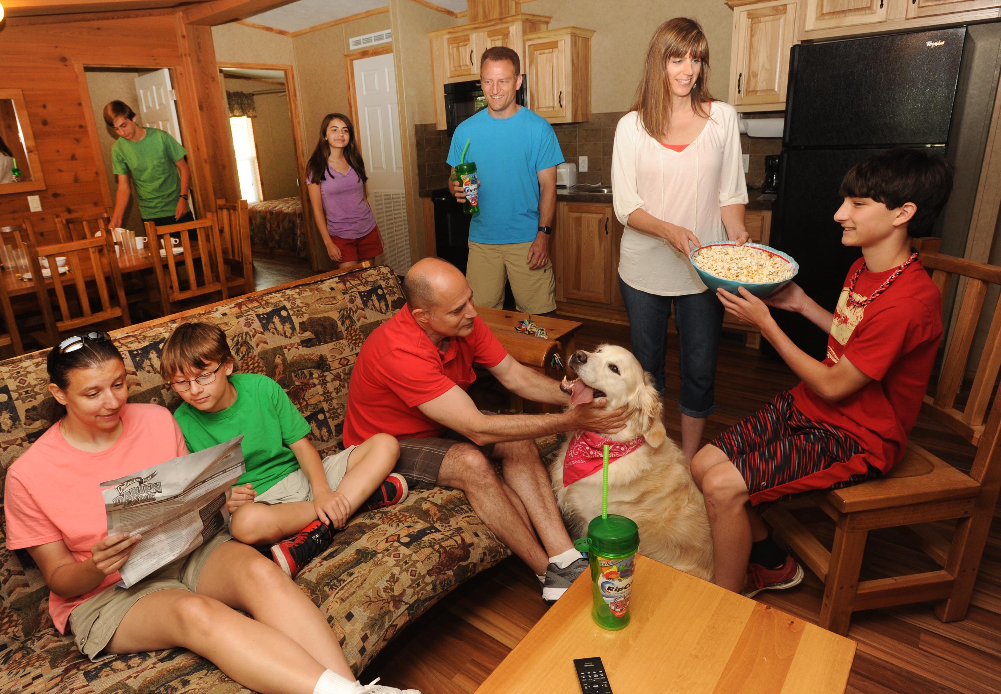 Family relaxing inside guest house