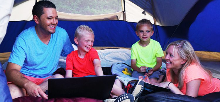 Family relaxing in tent